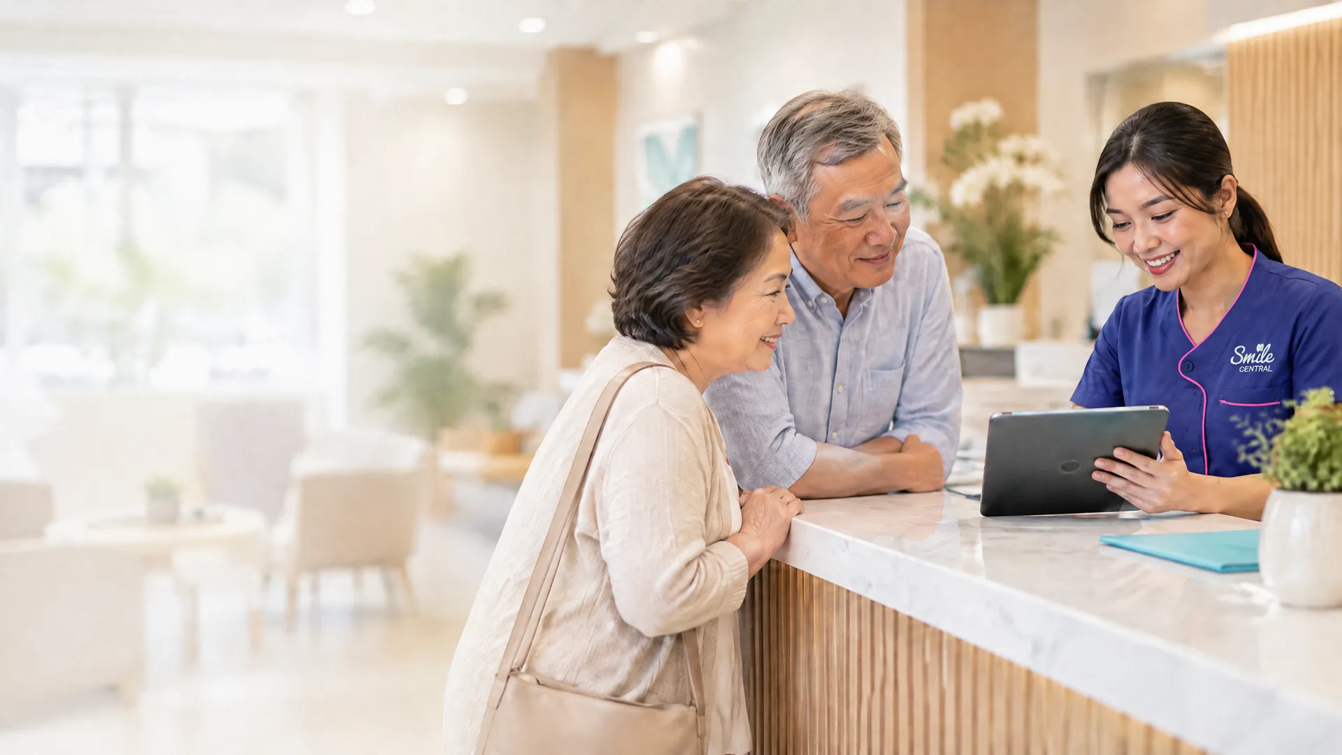A dentist explaining treatment costs to a patient at the front desk